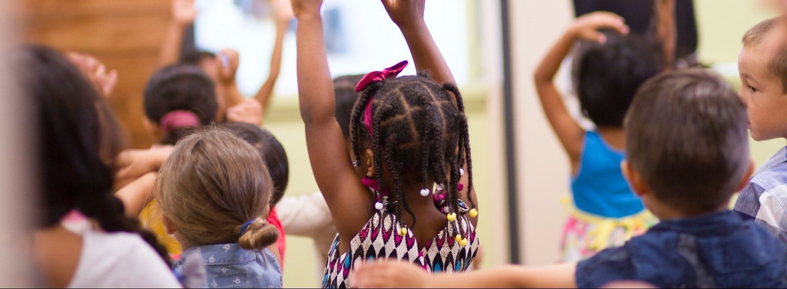 children lifting hands